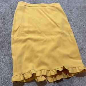 Ann Taylor yellow pencil skirt with slit in the back.